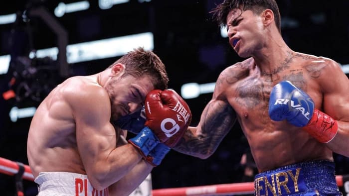 Ryan Garcia(R) exchanges punches with Oscar Duarte during their welterweight fight at Toyota Center in Houston, Texas. Ryan Garcia has beef with pop star Billie Ellish. CARMEN MANDATO/GETTY IMAGES.